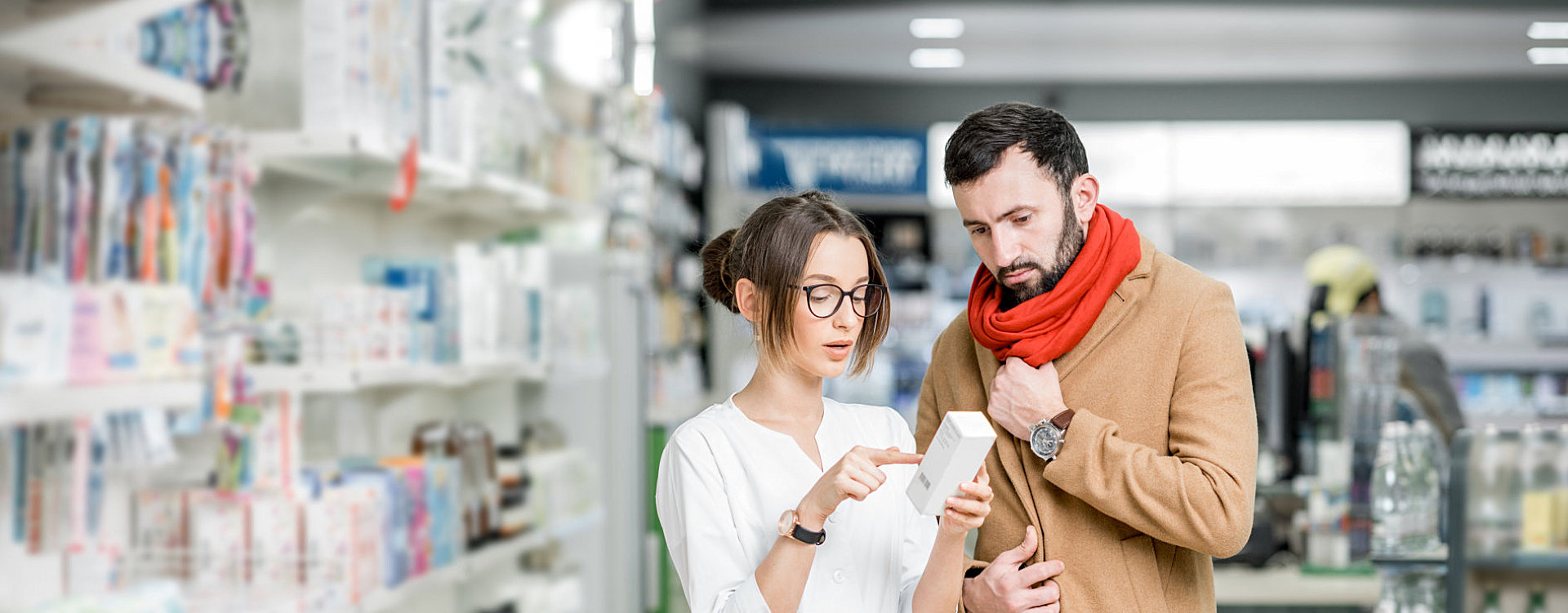 a pharmacist helping a customer